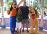 Janet, Simon and Biik with Pluto and Goofy