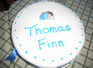 Thomas' cake made by his grandmother (grangie) and Emma's steady hand put on the writing